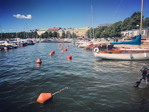 Helsinki harbor with boats and buoys on a sunny day